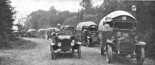 'Au Volant; convoi d'autos-camions menes par des conducteurs indo-chinois, sous..., 1918. Creator: Unknown.