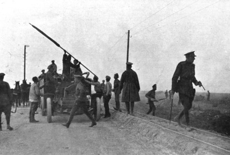 'Les Fuyards; Un auto camion emportant des soldats avec un drapeau est evacué par..., 1917. Creator: Unknown.