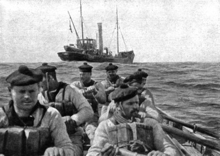 At Sea: The coastguard: boarding crew going aboard a suspect trawler..., 1917. Creator: Unknown.