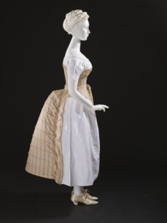 Woman's bustle, England, c.1885. Corset: c.1865-75, Chemise: c.1850-70, Shoes: 1875-1900. Creator: Unknown.