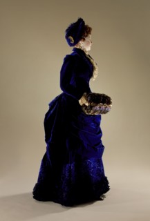 Woman's two-piece dress ensemble with matching hat, blue silk velvet., c.1880. Creator: Unknown.