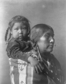 Apsaroke mother, c1908. Creator: Edward Sheriff Curtis.