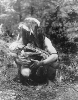 Preparing to eat the mummy, c1911. Creator: Edward Sheriff Curtis.