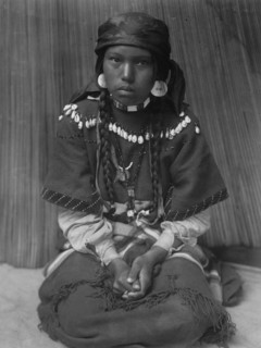 Touch her dress-Kalispel, c1910. Creator: Edward Sheriff Curtis.