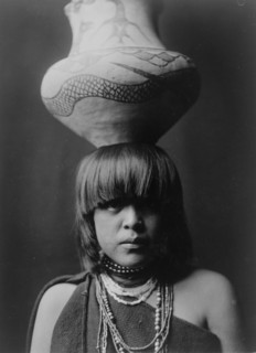Girl and jar-San Ildefonso, c1927. Creator: Edward Sheriff Curtis.
