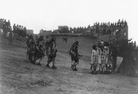 Snake dancers entering the plaza, c1905. Creator: Edward Sheriff Curtis.