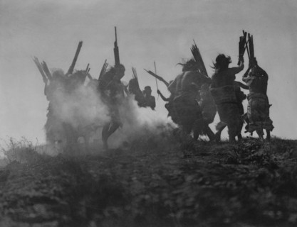 Dancing to restore an eclipsed moon, c1914. Creator: Edward Sheriff Curtis.