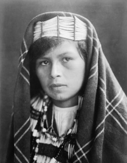 Quinault female head-and-shoulders portrait, facing slightly left, c1913. Creator: Edward Sheriff Curtis.