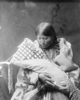 Cheyenne mother and child, c1905. Creator: Edward Sheriff Curtis.