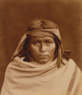 Tah-Lay, Apache? Indian, head-and-shoulders portrait, facing front, wearing blanket and..., c1903. Creator: Edward Sheriff Curtis.
