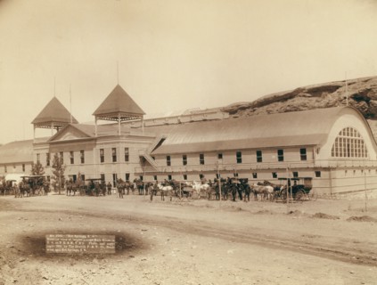 Hot Springs, SD Exterior view of largest plunge bath house in US on FE and MV R'y, 1891. Creator: John C. H. Grabill.
