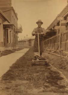 Dou Kee, Chinese servant, mowing the lawn, Dom Smith, Vladivostok, Russia, 1899. Creator: Eleanor Lord Pray.