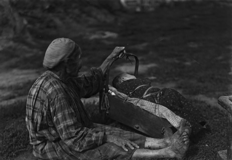 A woman with a cradle, 1890.  Creator: Unknown.