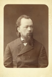 Half-length portrait of man, facing right, between 1880 and 1886. Creator: Unknown.