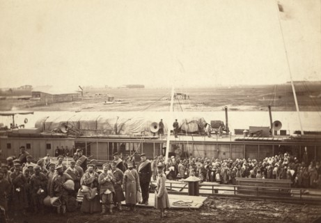 Party of exiles and convicts embarking on river barge at Tumen [ie, Tiumen]..., between 1885 and 86. Creator: Unknown.