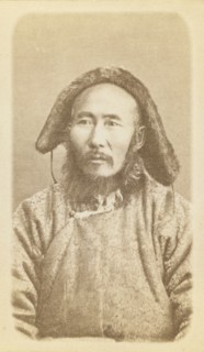 Half-length portrait of man, seated, facing slightly left, between 1870 and 1886. Creator: Unknown.