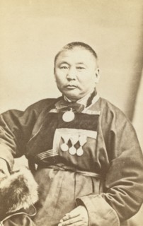 Half-length portrait of man, seated, facing slightly left, between 1870 and 1886. Creator: Unknown.