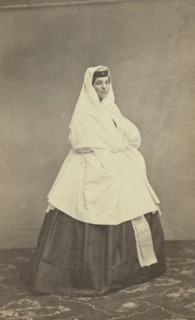 Full-length portrait of Georgian woman, facing right, between 1870 and 1886. Creator: Unknown.