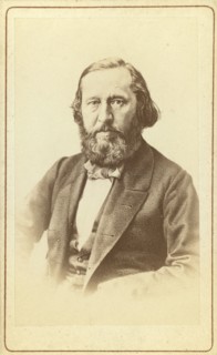 A Aksakov, half-length portrait, facing front, between 1880 and 1886. Creator: Unknown.