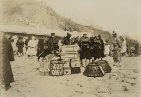 Japanese Hospital Corps landing medical and surgical supplies at Chemulpo, c1904. Creator: Robert Lee Dunn.