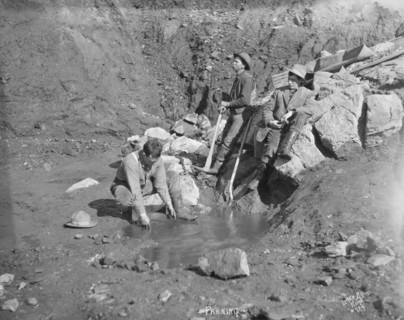 Men panning gold, between c1900 and 1927. Creator: Lomen Brothers.