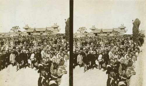 A crowd of Japanese soldiers; Chinese coolies in right foreground, Manchuria, c1905. Creator: Underwood & Underwood.