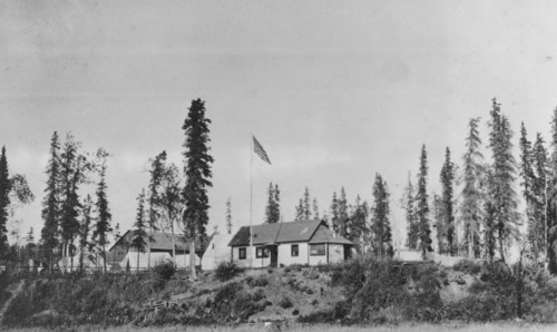 Building with American flag raised, between c1900 and 1916. Creator: Unknown.