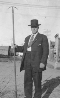 Man holding a tool, between c1900 and 1916. Creator: Unknown.