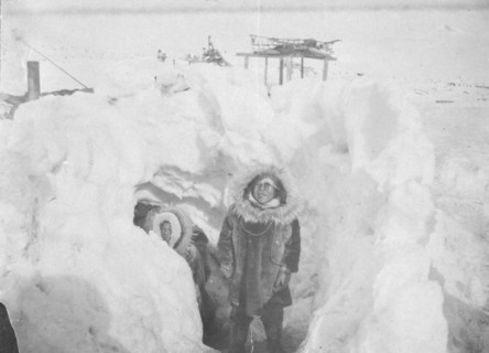 Alaskan Eskimos with their winter home half underground in village of Stebbins, c1900- c1930. Creator: Unknown.
