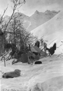 Explorer's tent and belongings anchored securely so they won't be blown away, c1900-c1930. Creator: Unknown.