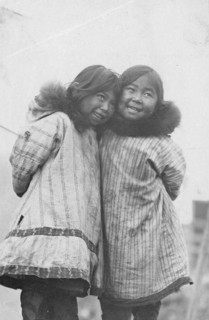Two Eskimo girls standing side by side, between c1900 and c1930. Creator: Unknown.