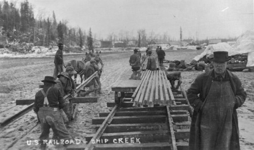 Laying first rails of new U.S. railroad at Ship Creek, between c1900 and c1930. Creator: Unknown.