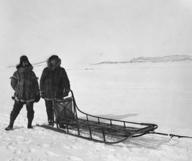 Mr. Bowen and Mr. Delezene with racing sled in an All Alaska Sweepstakes, between c1900 and 1927. Creator: Unknown.