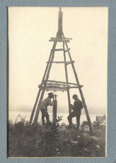 The moment of carrying out triangulation measurements under a tower on the river bank, 1909. Creator: Vladimir Ivanovich Fedorov.