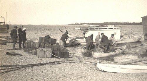 Unloading gasoline from boats on the Zee River during windy conditions, 1909. Creator: Vladimir Ivanovich Fedorov.