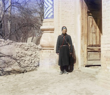 Policeman standing in front of doorway, between 1905 and 1915. Creator: Sergey Mikhaylovich Prokudin-Gorsky.