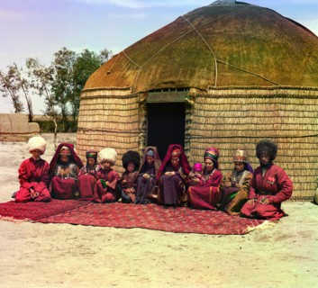 Group of eleven adults and children, seated on a rug, in front of a yurt, between 1905 and 1915. Creator: Sergey Mikhaylovich Prokudin-Gorsky.