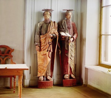 Two carved wooden statues of bearded men with haloes above their head..., between 1905-1915. Creator: Sergey Mikhaylovich Prokudin-Gorsky.