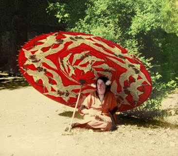 Woman sitting under a parasol, between 1905 and 1915.  Creator: Sergey Mikhaylovich Prokudin-Gorsky.