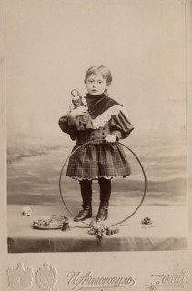 Portrait of a girl with a hoop and a doll, 1900. Creator: I. Antonopulo.