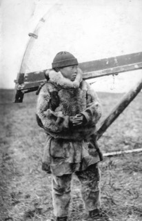 Chukchi boy in national clothes, kukhlyanka, fur pants, 1910-1929. Creator: Ivan Emelianovich Larin.