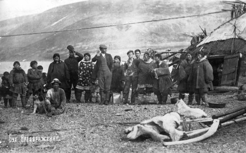 Preobrazhenie Bay: Chukchi in front of their home, in national traditional fur clothing..., 1910-29. Creator: Ivan Emelianovich Larin.