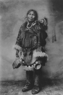 Eskimo mother carrying a child on her back, 1916(?). Creator: Unknown.
