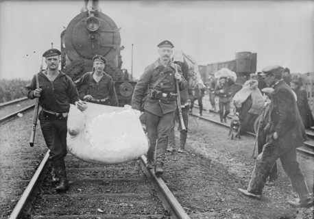 Germans helping refugees returning to Antwerp, 1914. Creator: Bain News Service.