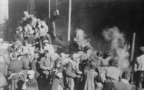 Poor in North France fed from German field kitchen, between c1914 and c1915. Creator: Bain News Service.