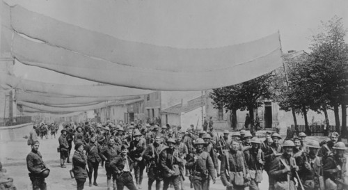 U.S. troops on camouflaged road, 11 May 1918. Creator: Bain News Service.