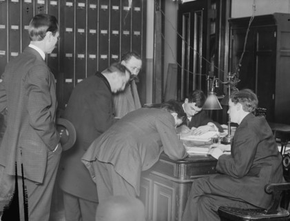 New citizens signing naturalization papers in judge's chambers, 1910. Creator: Bain News Service.