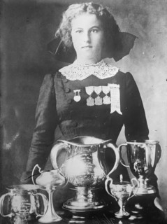 Alsie Aykroyd in front of her trophies, 1910. Creator: Bain News Service.