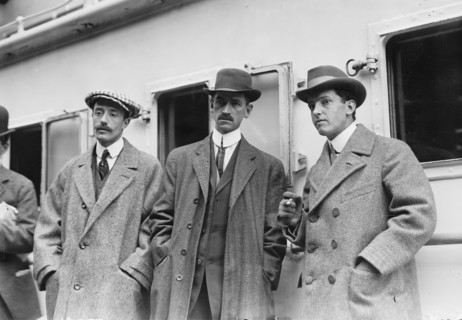 Count de Lesseps, G. Curtiss, and H. Latham standing on train platform, 1910. Creator: Bain News Service.