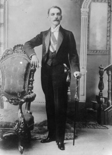 C.E. Restrepo posing next to chair, with cane, 1910. Creator: Bain News Service.